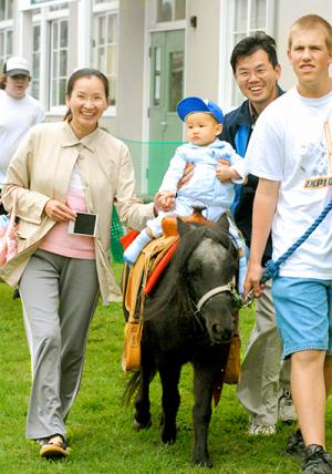 University Village Welcome Fair Child on Pony